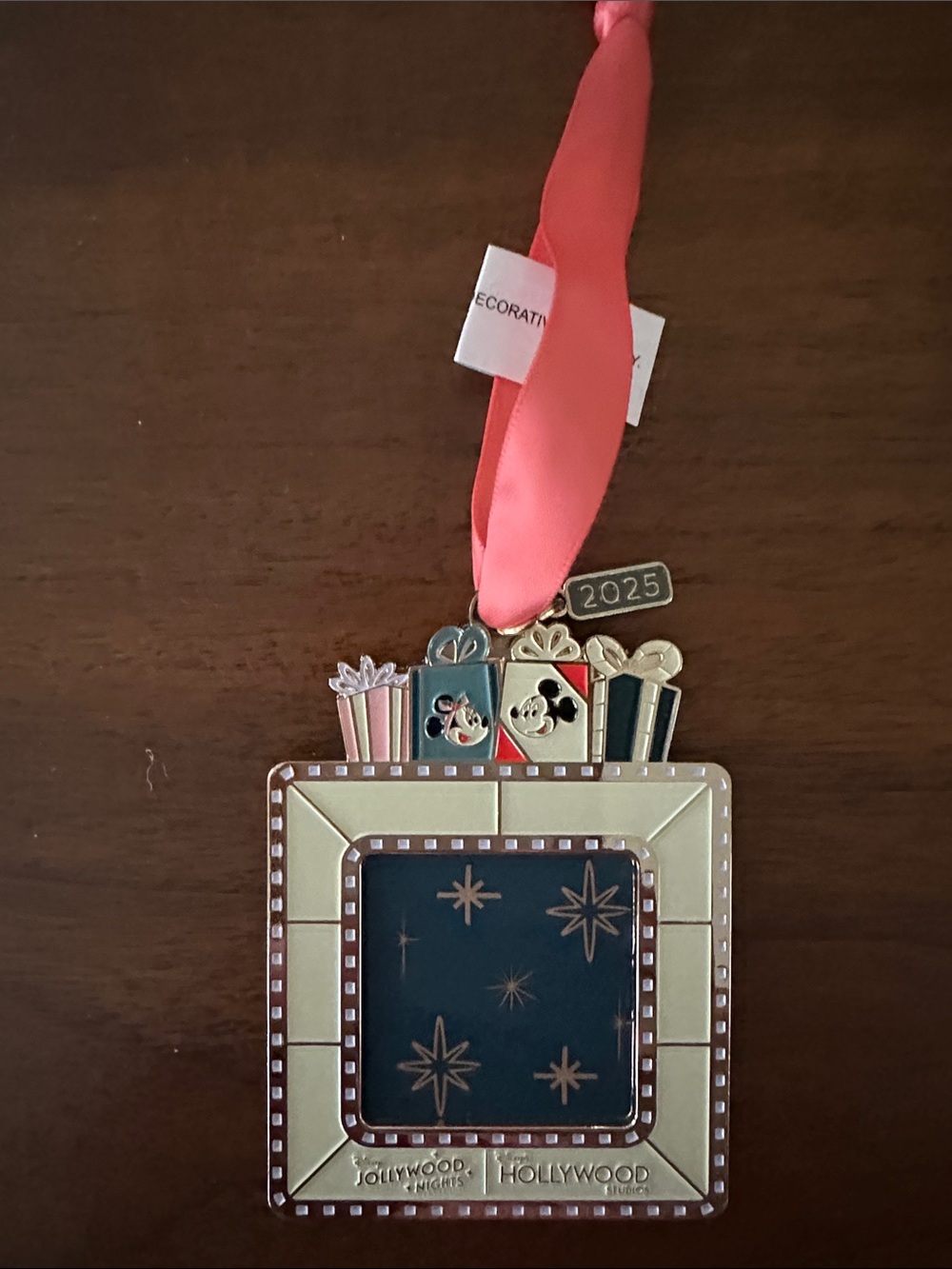 New Disney Gold Frame Ornament with orange Ribbon and Gift Accents